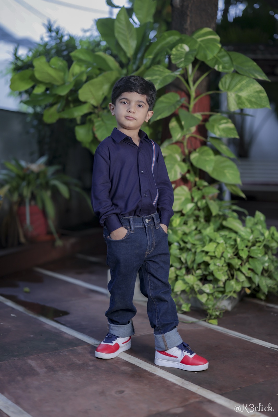 Navy shirt with striped suspenders
